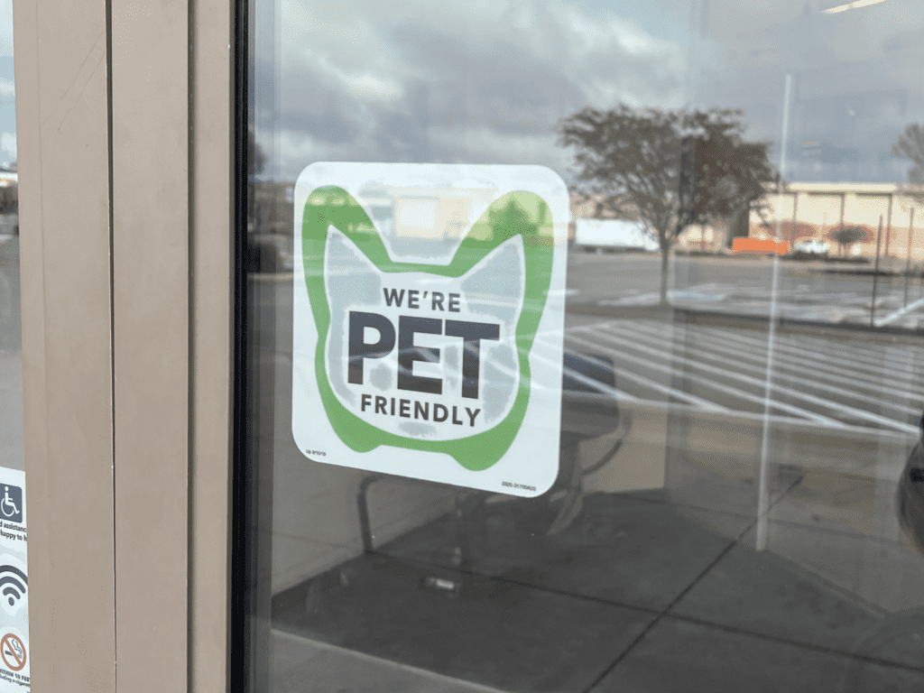 Photo of a sticker on the door of Joann's that states we're pet friendly.